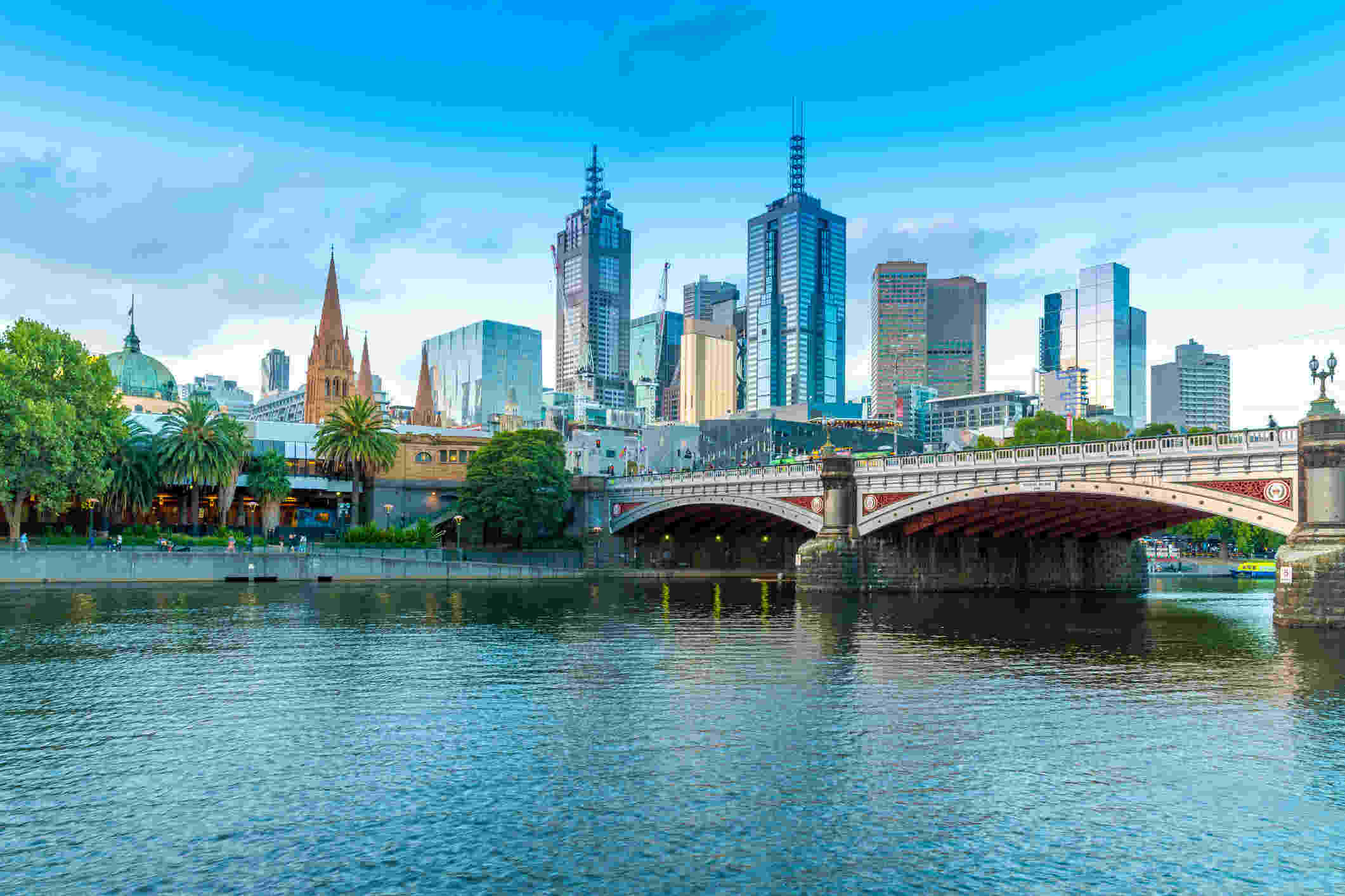 An image of Princes Bridge in Melbourne, Australia, a cast iron bridge spanning the Yarra River with a city skyline in the background.