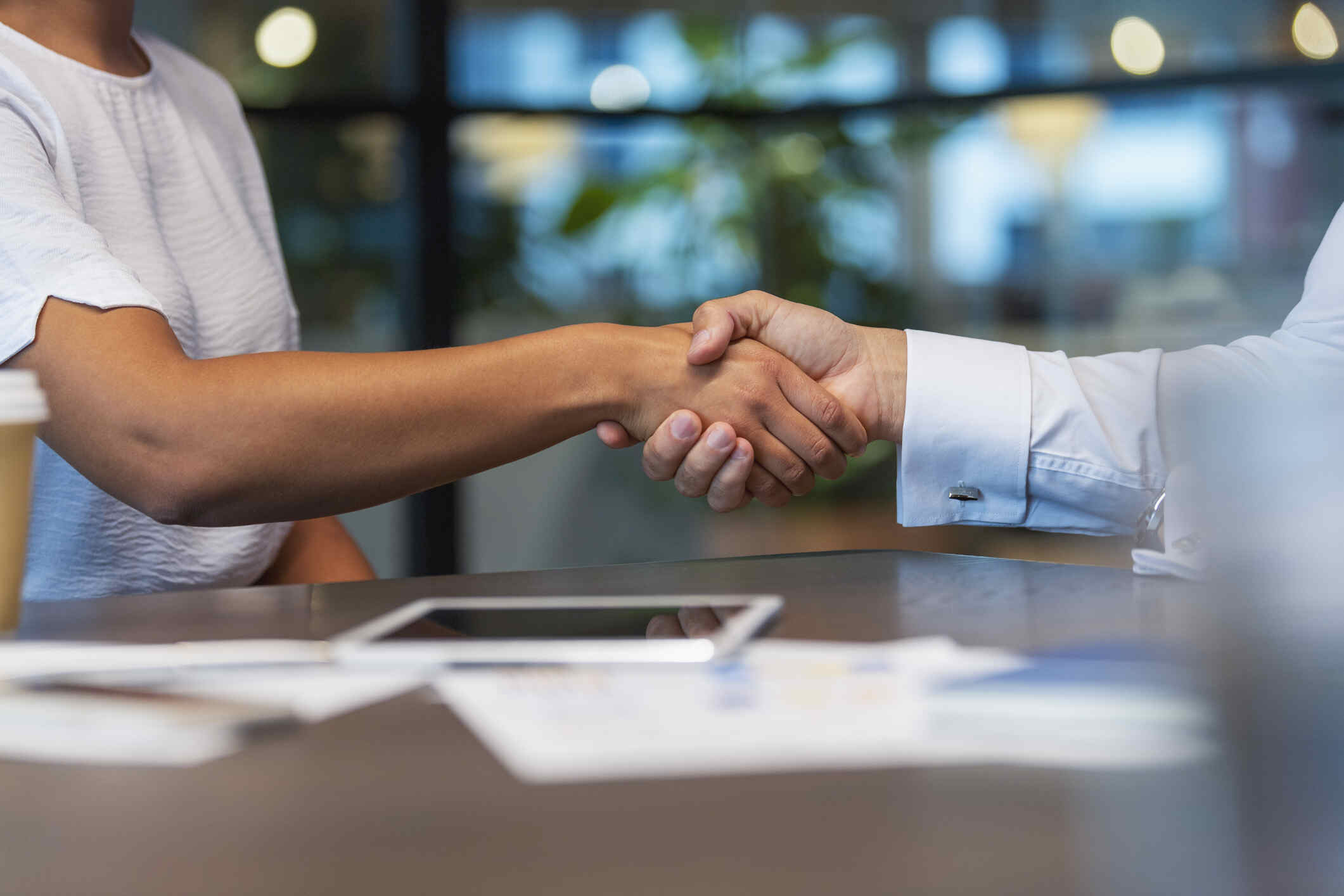 A professional handshake between colleagues or partners, symbolizing agreement or collaboration